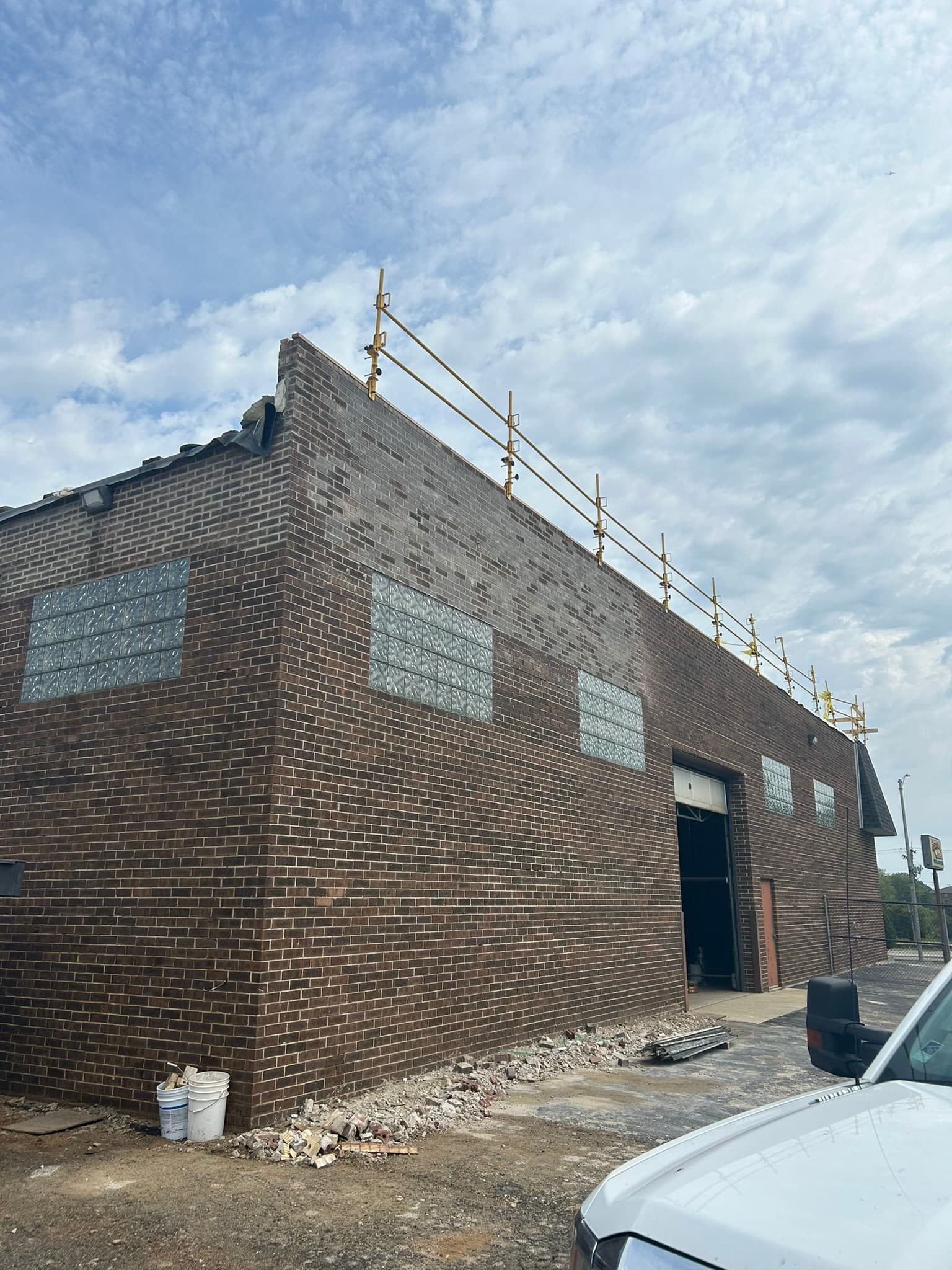Repaired brick parapet wall on a commercial building in Bolingbrook Illinois Route 53 corridor
