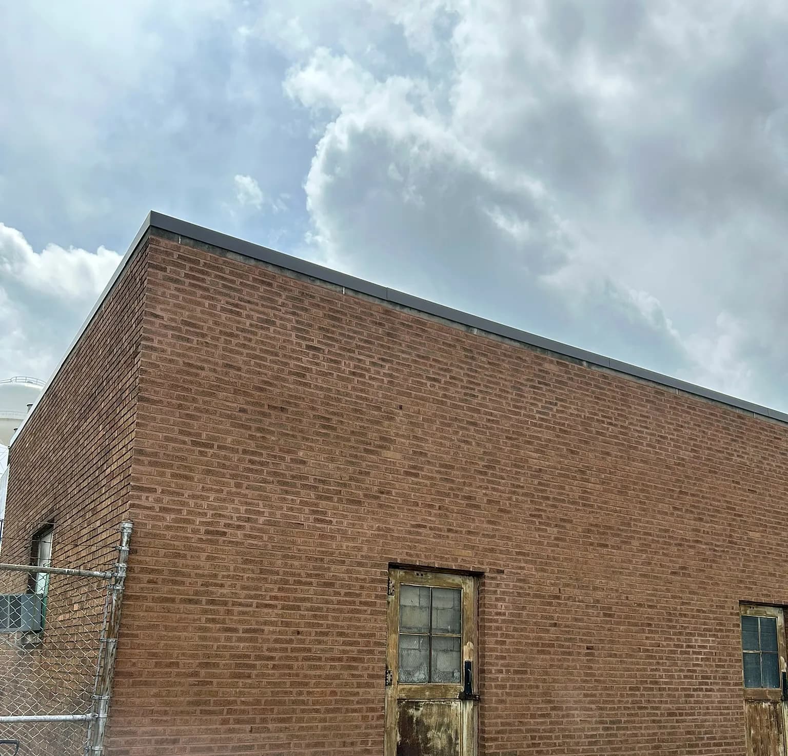 Commercial brick façade rebuilt at the corner of a Chicagoland warehouse
